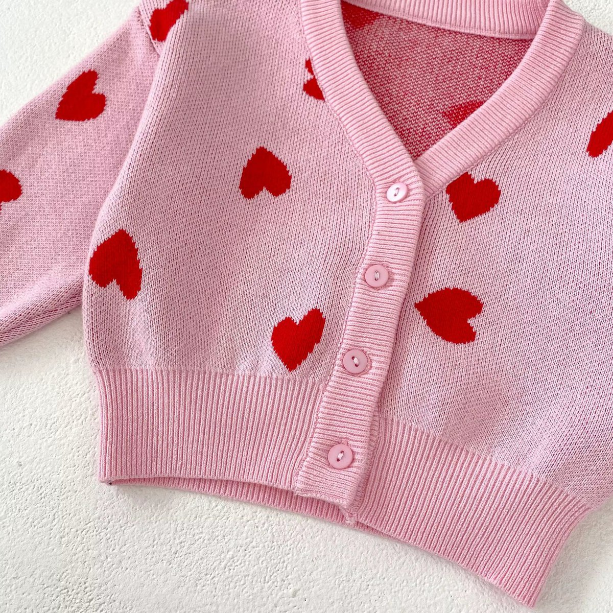 Roze vestje met hartjesprint in verschillende maten