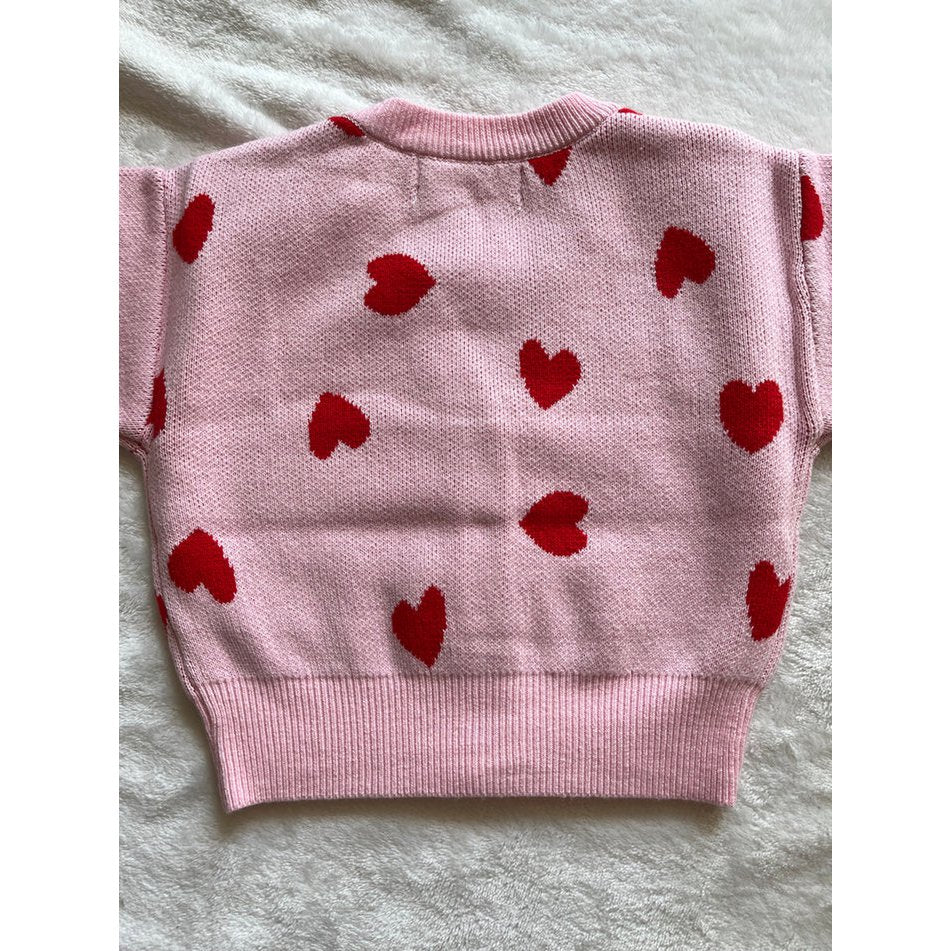 Roze babyvest met rode hartjes als kraamcadeau